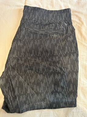 RHONE Black Shorts with White Pinstripe Detail